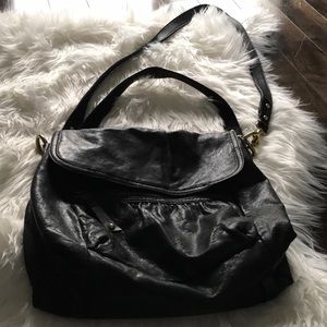 Soft black leather fossil bag with gold hardware